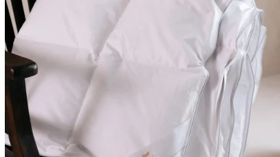Slapen in ware luxe: wat bepaalt de prijs van een donzen dekbed?